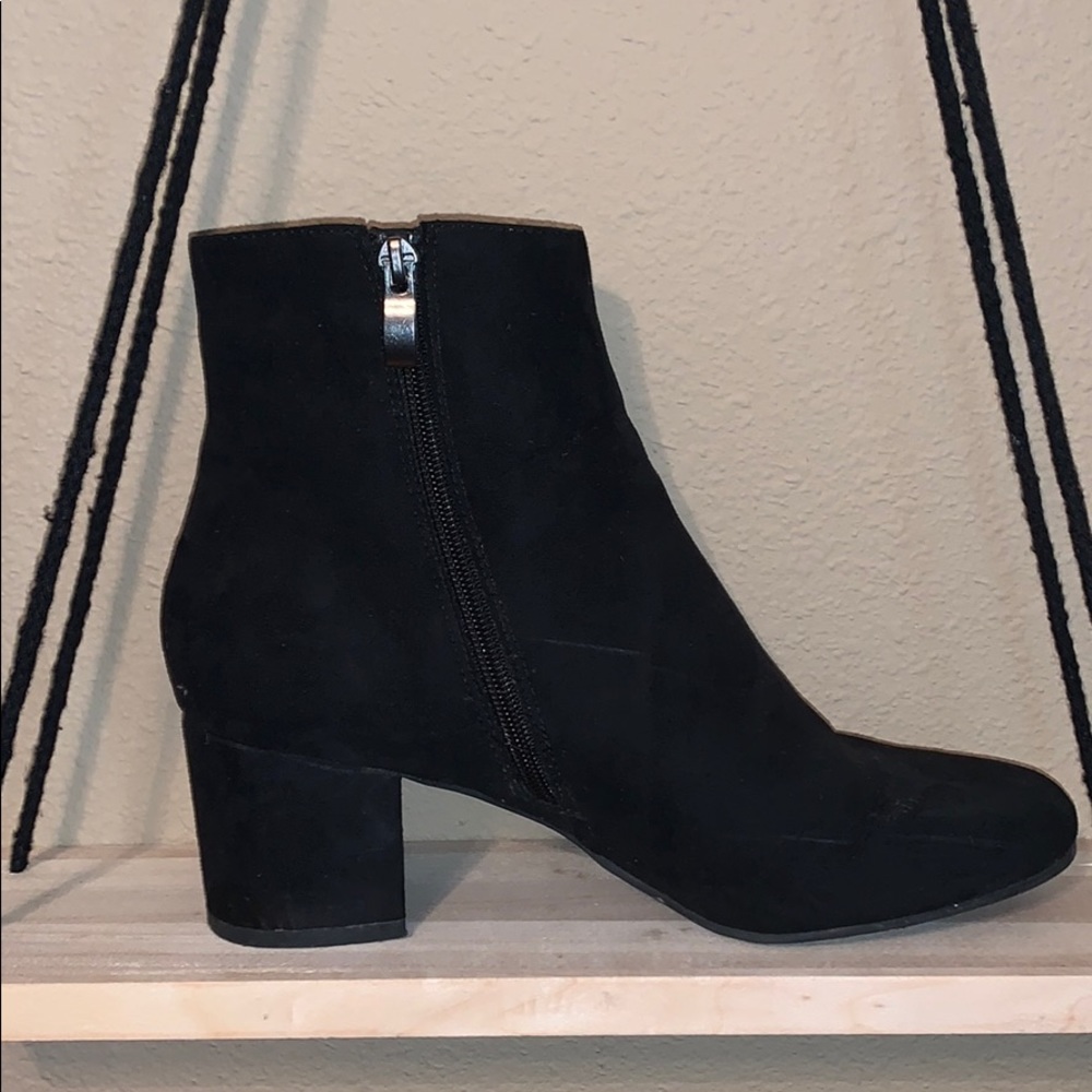 Black velvet heeled booties.